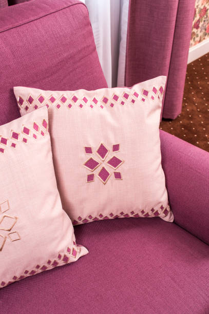 pillows on a sofa - pillow cushion embroidery homewares imagens e fotografias de stock