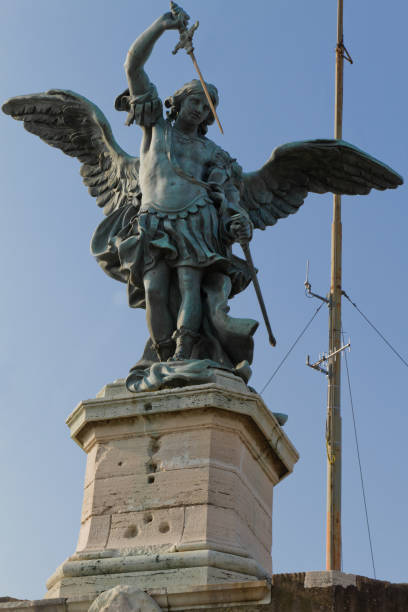 Saint Michael's Sculpture Against A Blue Sky