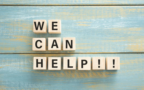 istock WE CAN HELP text on a wooden cubes on a wooden background. 1310489060