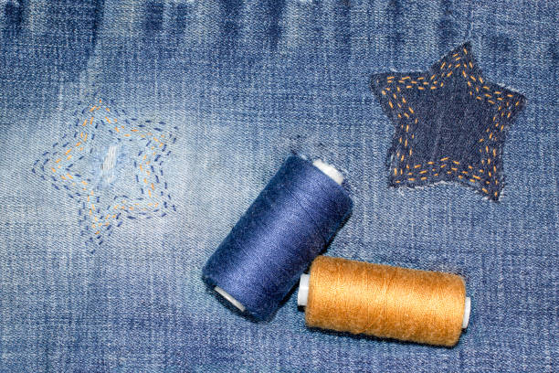 Old jeans with an upcycled hole. Concept of things reuse and natural resources preserving.