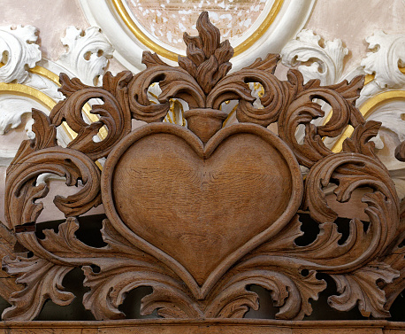 Wood heart symbol on a white background. 3d illustration.