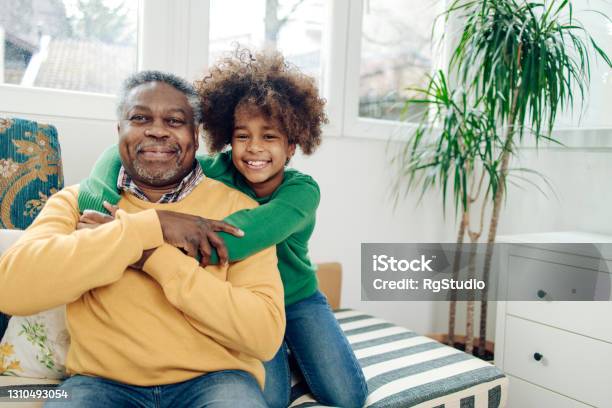 Portrait Of A Happy Girl And Her Grandpa Stock Photo - Download Image Now - Grandfather, Teenager, Smiling