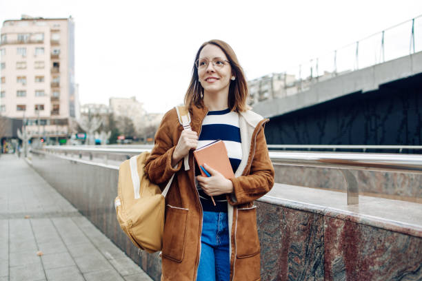 istock Beautiful student on her way to the university 1310493355
