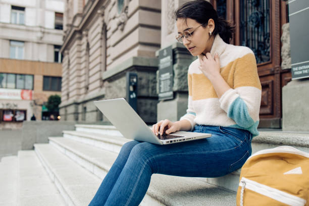 istock Beautiful student learning in front of her university 1310493404