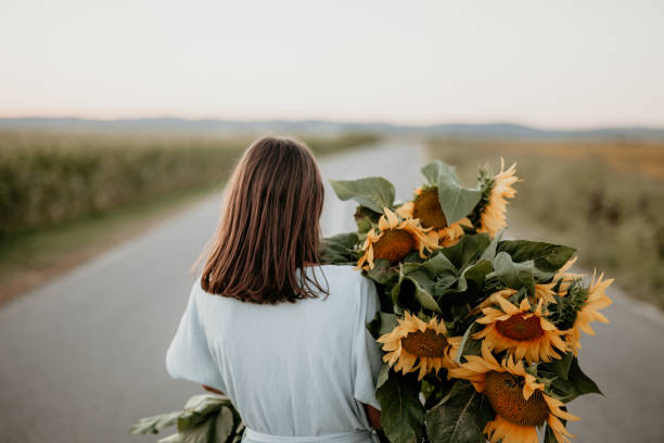 istock Unrecognizable person holding sunflowers 1310494341