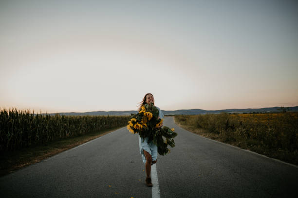 istock Cheerful female running, landscape in background 1310495470