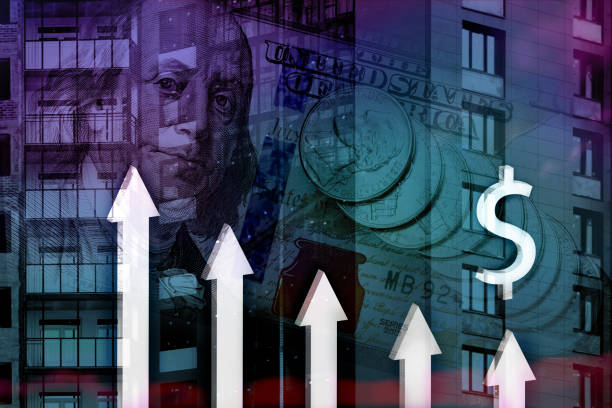 istock 3d down arrows on background of building under construction and US banknotes. Concept of reducing cost of housing, uncertainty in business, financial transactions during global crisis 1310496744