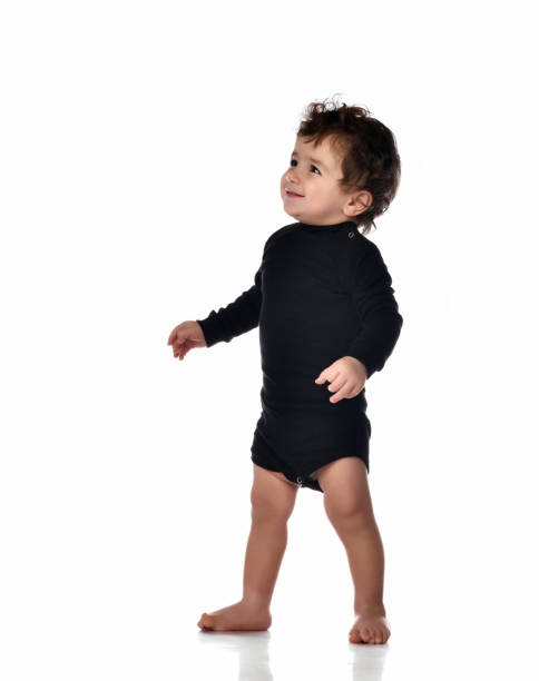 istock First steps of baby isolated on white background 1310496927