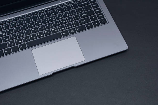istock Open laptop on a black background close-up. 1310500599