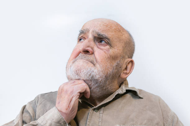 istock senior man thinking isolated on white background 1310506136