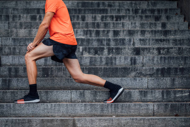 istock Anonymous Man Stretching and Warming up for a Jog in the Forest 1310506229