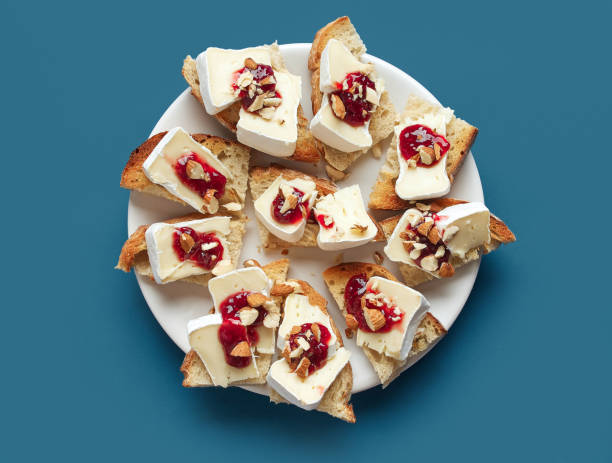 plate of toasted bread slices with fresh brie cheese