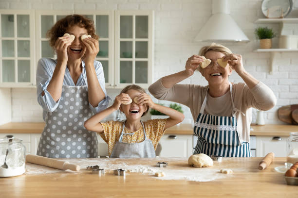 istock Happy three generations of women have fun baking 1310511862