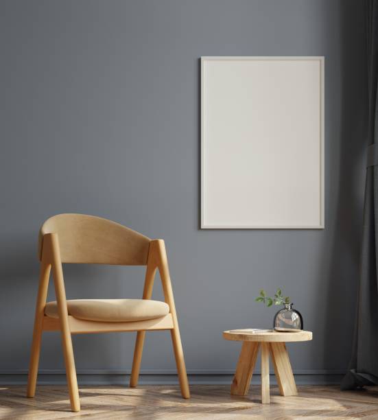 istock Poster mockup with vertical frames on empty dark wall in living room interior with velvet armchair. 1310518372