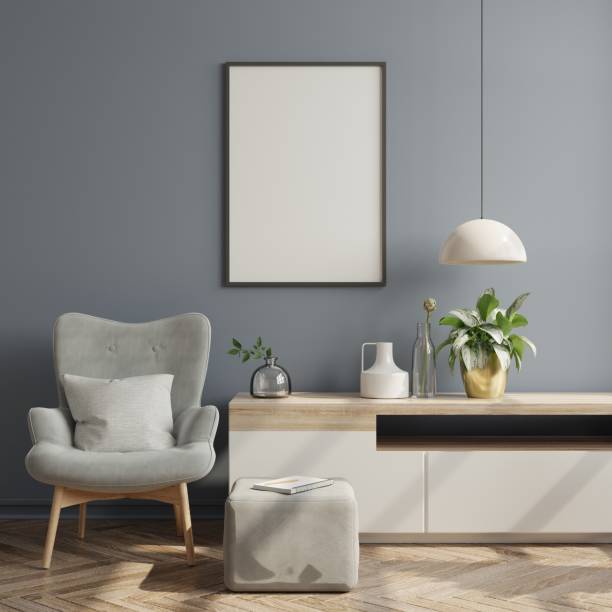 istock Poster mockup with vertical frames on empty dark wall in living room interior with velvet gray armchair. 1310518395