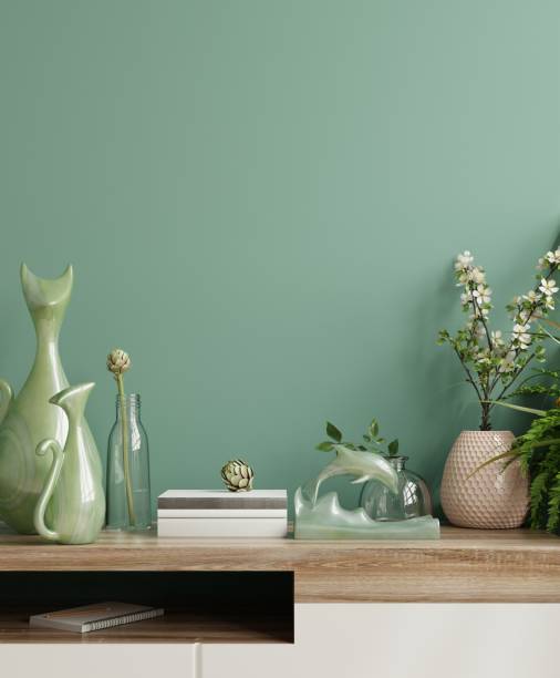 istock Interior wall mockup with green plant,Green wall and shelf. 1310518545