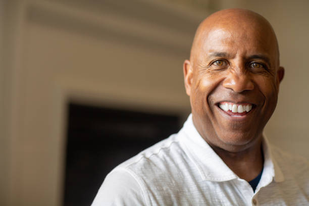 istock Mature African Americian man smiling and looking at the camera. 1310523634