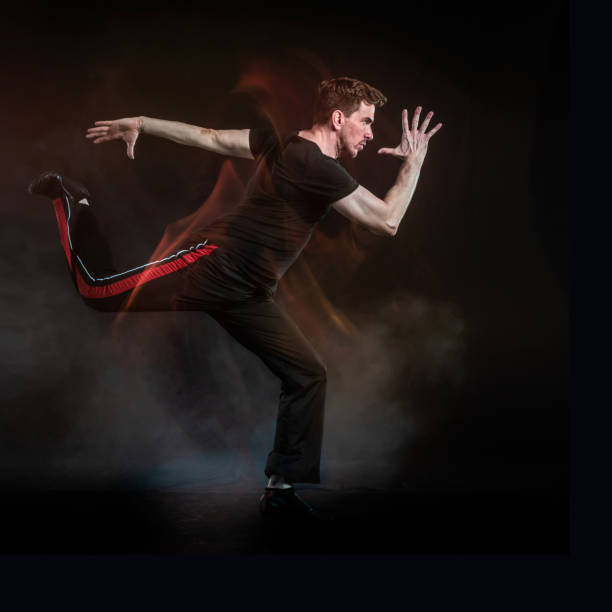 istock Latin athlete running on black background 1310527804