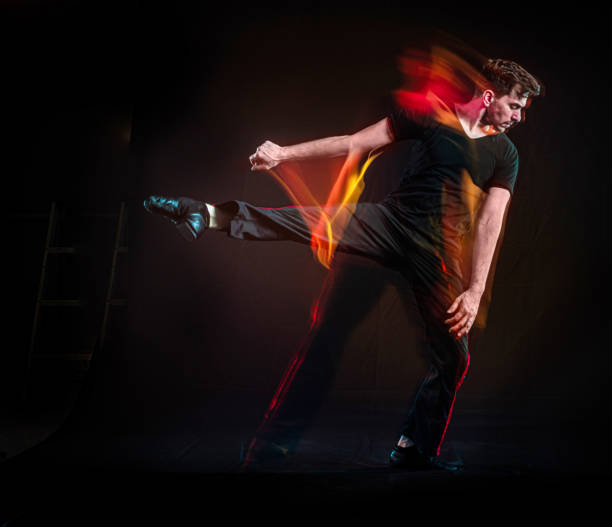 istock Cuban american man dancing with slow motion color effects 1310527808