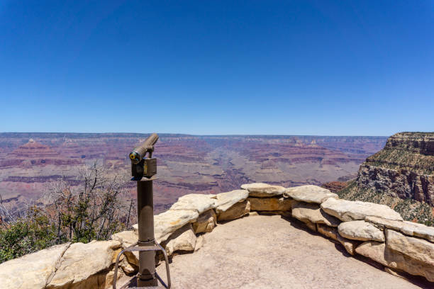 istock Looking at the Grand Canyon through a telescope 1310534190
