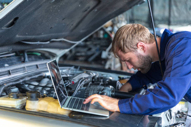 istock A Russian Male mechanic  with tablet pc computer making system diagnostic in car at workshop. car service, repair, technology, maintenance and people concept 1310535721