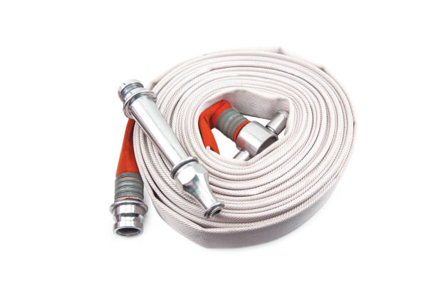 istock Red fire hose coil isolated on the white background. 1310536399