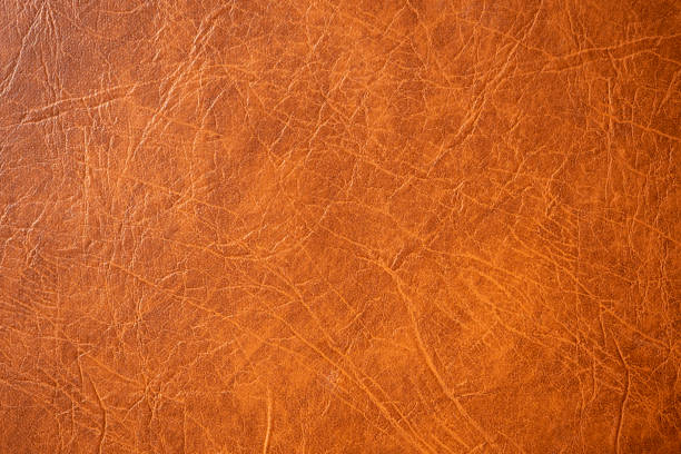 istock Natural leather texture close up. Brown leather upholstery. Abstract background. 1310537200