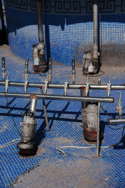 istock Old non-working abandoned fountain pipes. Empty pool. 1310539704