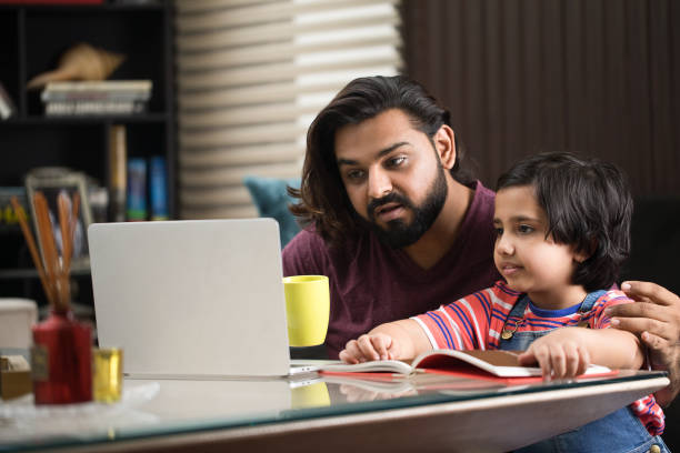istock Father educating his daughter at home 1310543661