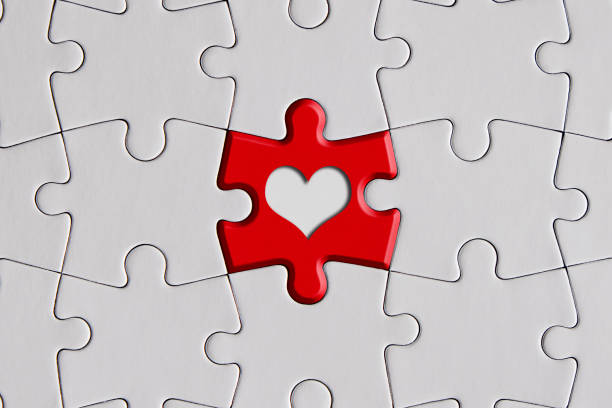 istock Red jigsaw puzzle with heart shape 1310547495