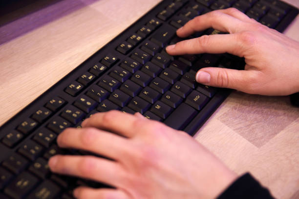 istock Business woman hand typing and using computer keyboard for searching with technology networking on working and job on desk 1310551053