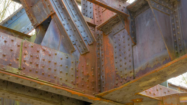 Rusted components of an old railway bridge