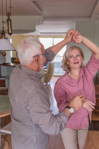 istock Love Never Grows Old. An Older Couple is Dancing at Home. 1310558536