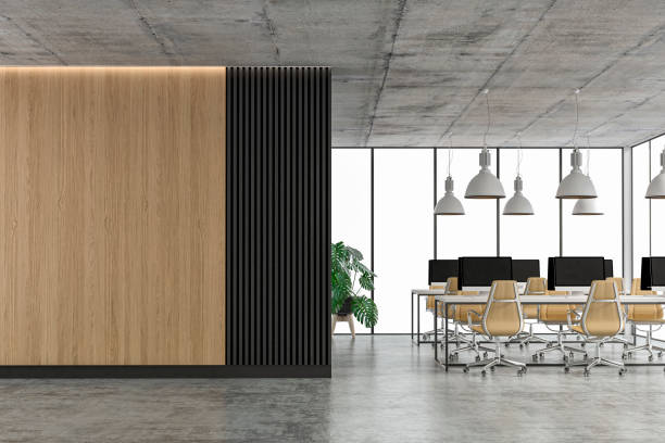 istock Empty office interior with copy space and wordesks on concrete floor 1310560510