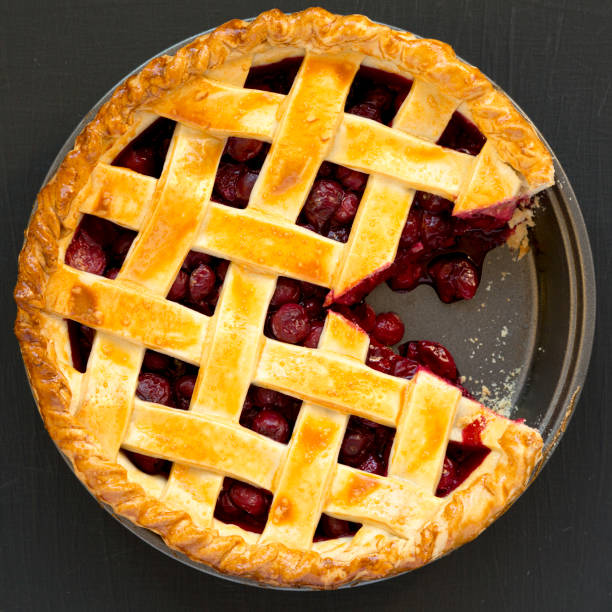 istock Yummy Homemade Cherry Pie on black background, top view. Flat lay, overhead, from above. 1310560757
