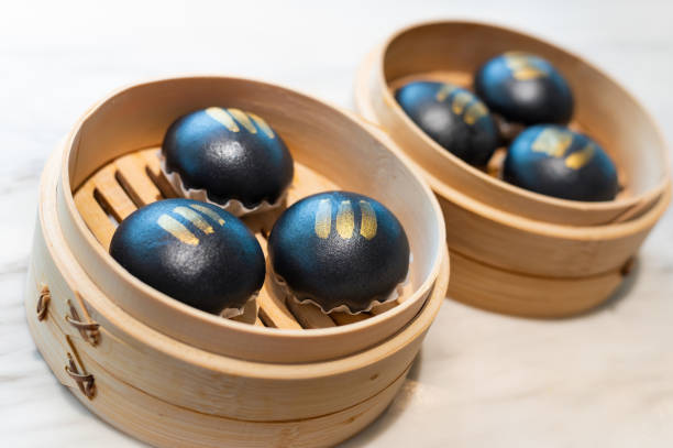 istock Steamed charcoal buns with pumpkin sauce 1310560911