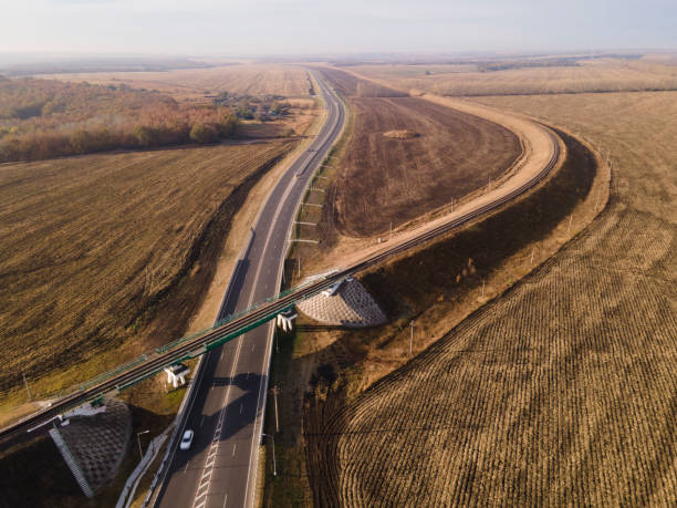 istock Aerial Top View of highway intersection junction summer morning 1310562992