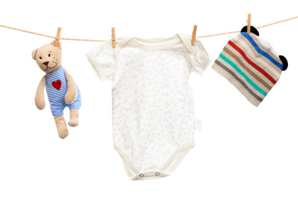 istock Baby clothes on a clothesline on white  background - Image 1310564034