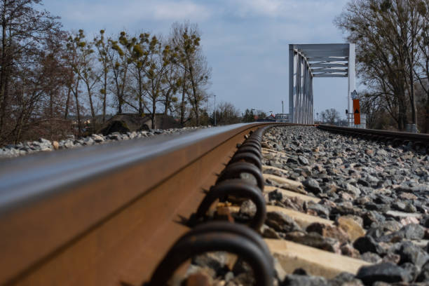 istock A close-up on rails and a railway bridge. 1310564687