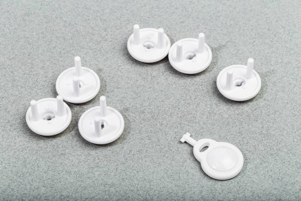 istock Protective Socket plugs on gray background  child safety 1310564798