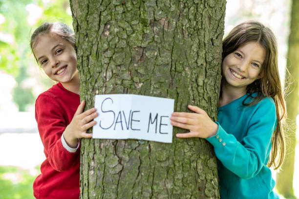istock Beauty girls saving a tree 1310565168
