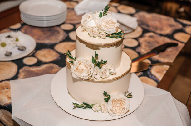 istock Beautiful wedding cake decorated with flowers, cake close up and blur background 1310565729