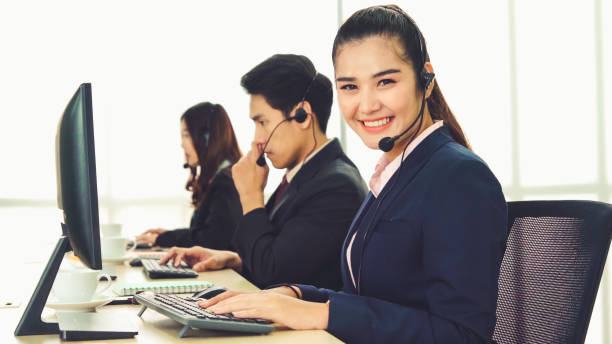 istock Business people wearing headset working in office 1310569709