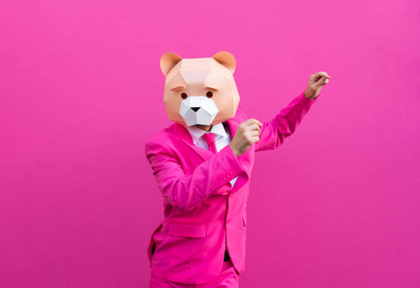 Man with funny low poly mask on colored background Happy man with funny low poly mask on colored background - Creative conceptual idea for advertising,adult with low-poly origami paper mask doing funny poses party funny stock pictures, royalty-free photos & images