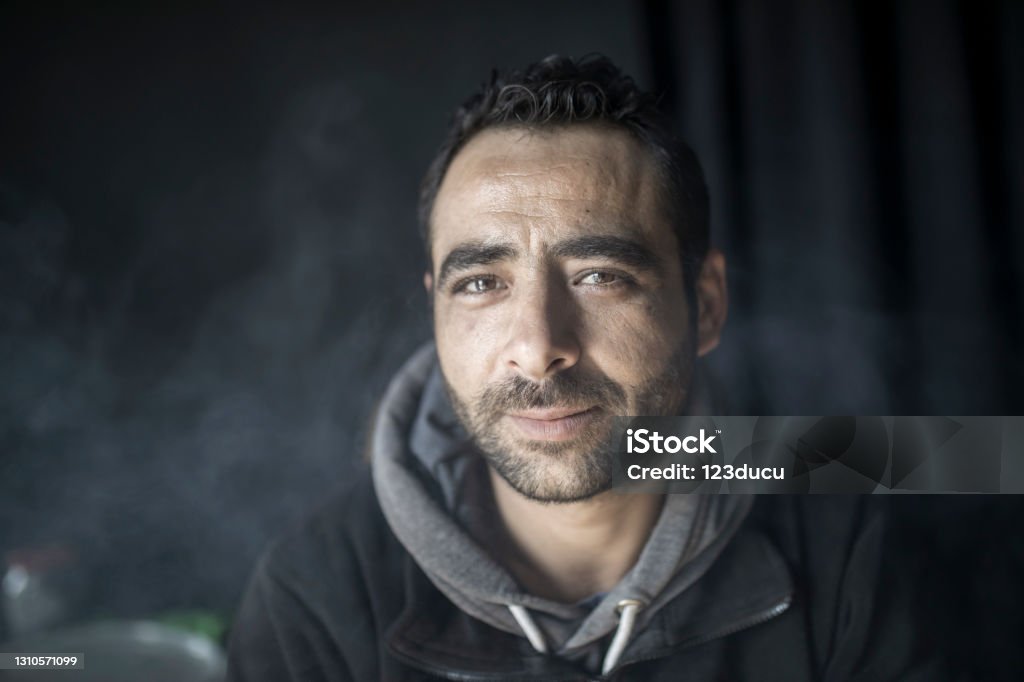 Syrian Male Portrait Portrait of middle eastern refugee Homelessness Stock Photo