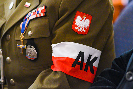Armband of the Armia Krajowa AK, on the shoulder and mudurd of a Polish soldier.