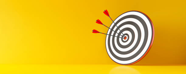 istock Archery target and arrow with yellow wall 1310573561