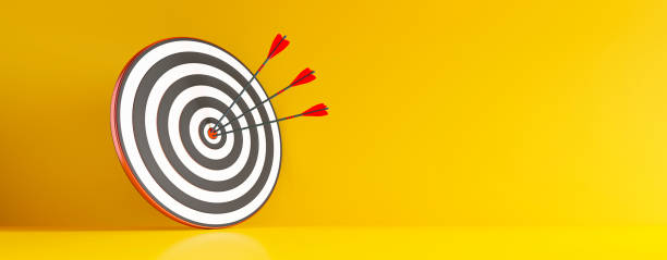 istock Archery target and arrow with yellow wall 1310573564