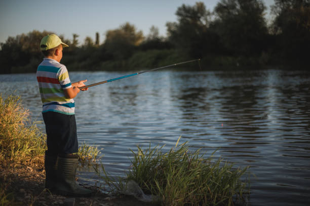 istock A boy fishing on the river 1310574579