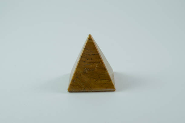 istock Mineral stone pyramid, close-up, side view